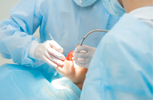 patient getting oral surgery at the dentist